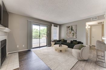 A living room with a fireplace and a couch.